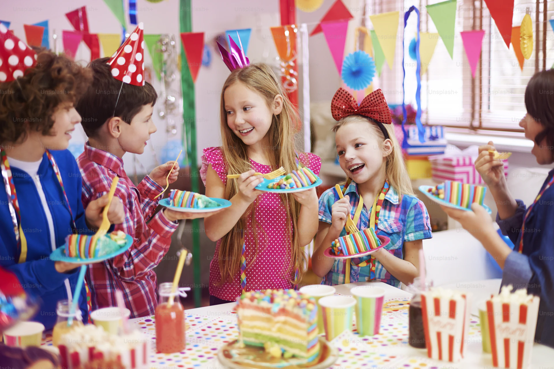 Children enjoying a party with balloons